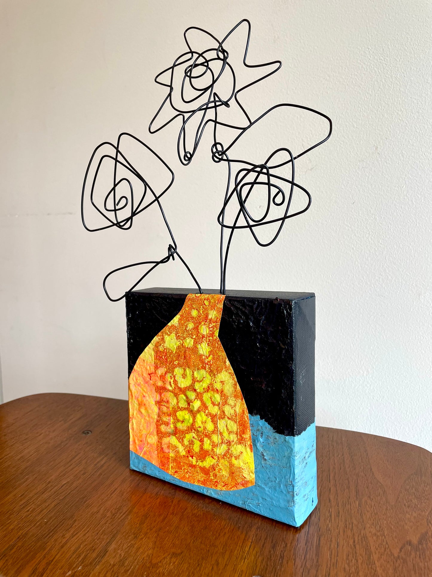 “Tiny Bloom, Big Mood” $150- 6"x 6" canvas with wire doodle flowers emerging from the top