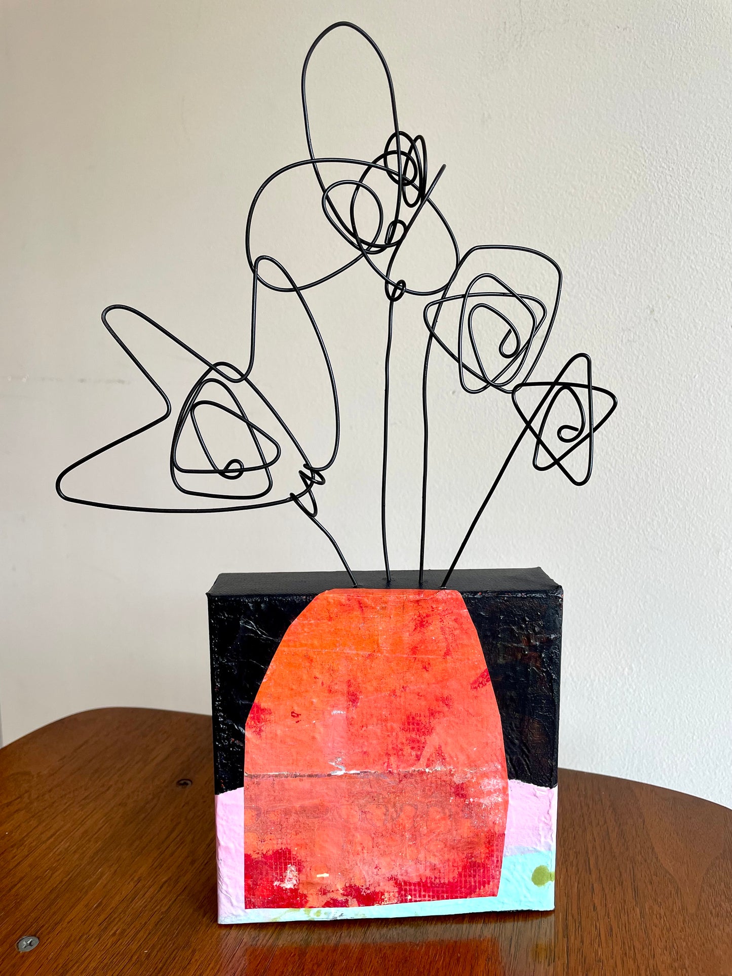 “First Bloom Energy” $150- 6"x 6" canvas with wire doodle flowers emerging from the top