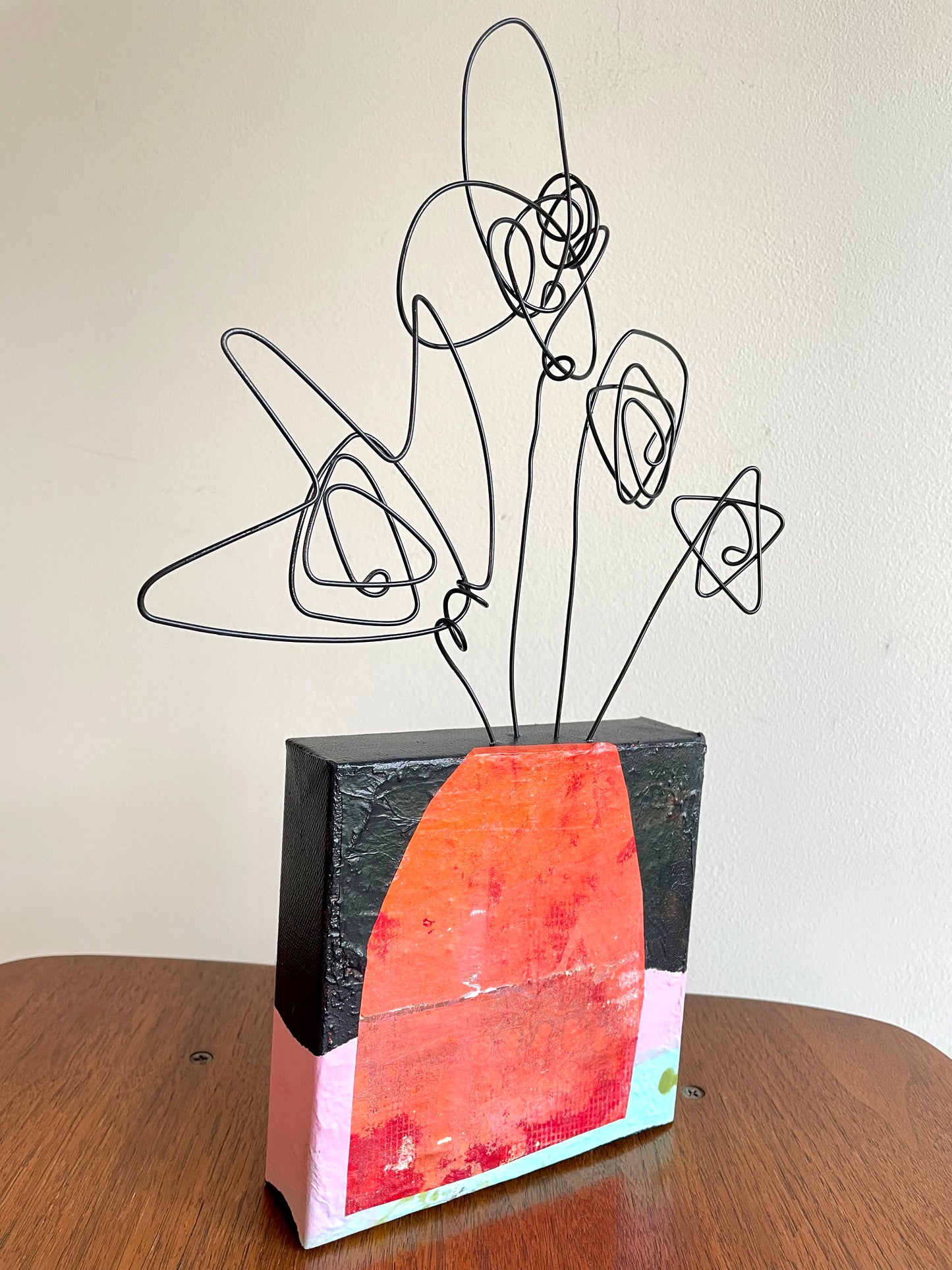 “First Bloom Energy” $150- 6"x 6" canvas with wire doodle flowers emerging from the top