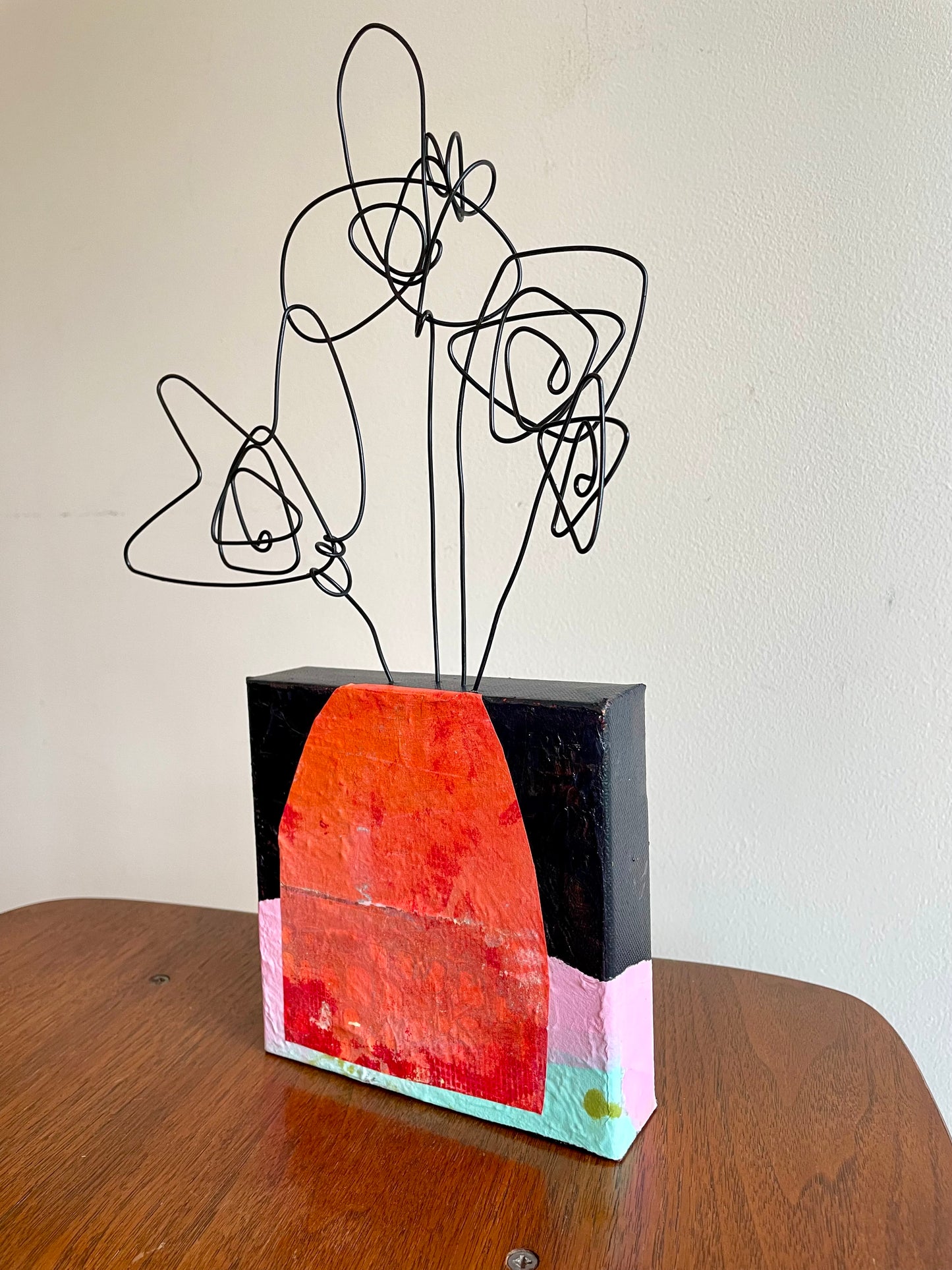 “First Bloom Energy” $150- 6"x 6" canvas with wire doodle flowers emerging from the top