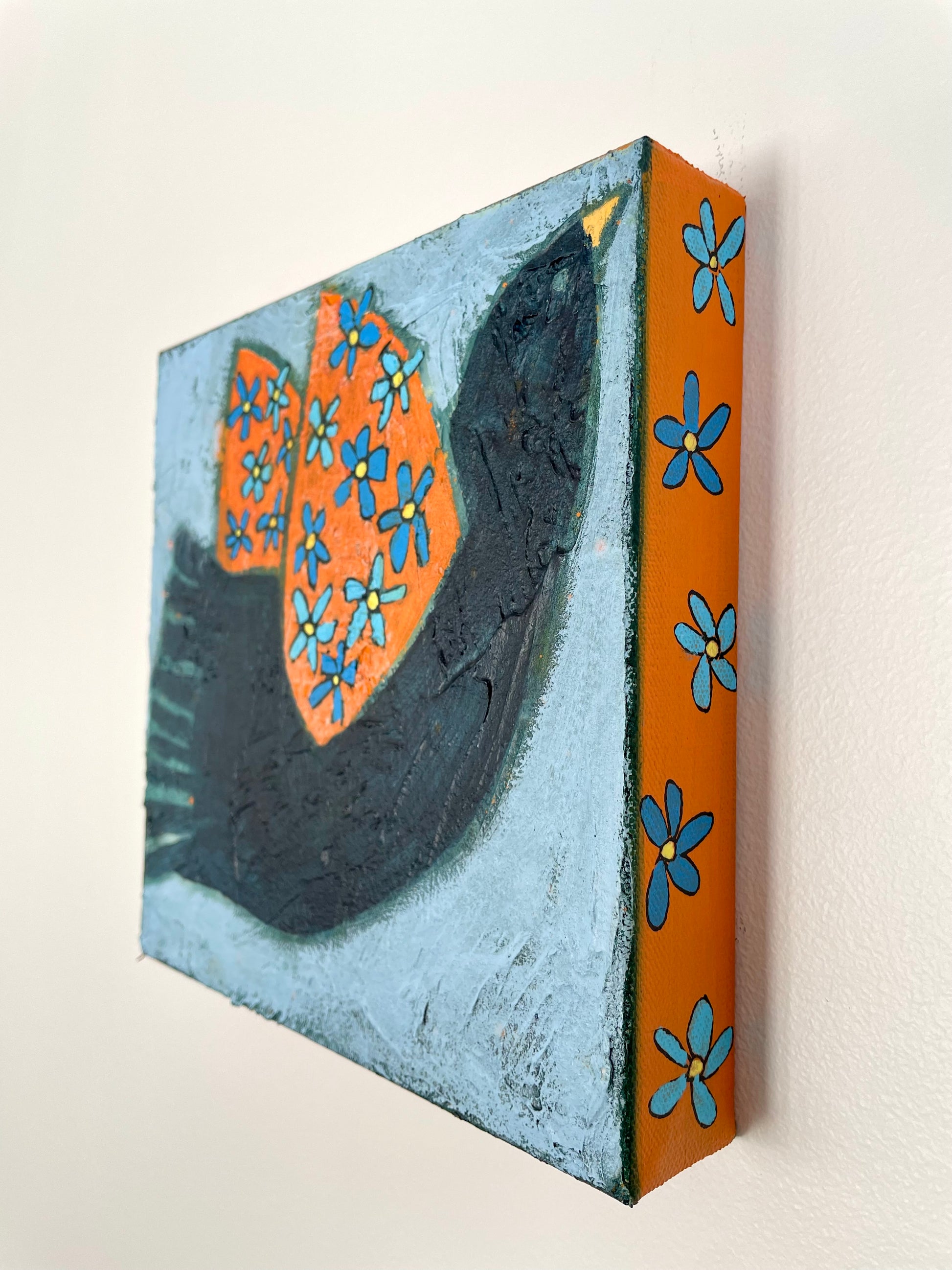Side view of Take These Wings and Learn to Fly showing painted canvas edges and texture