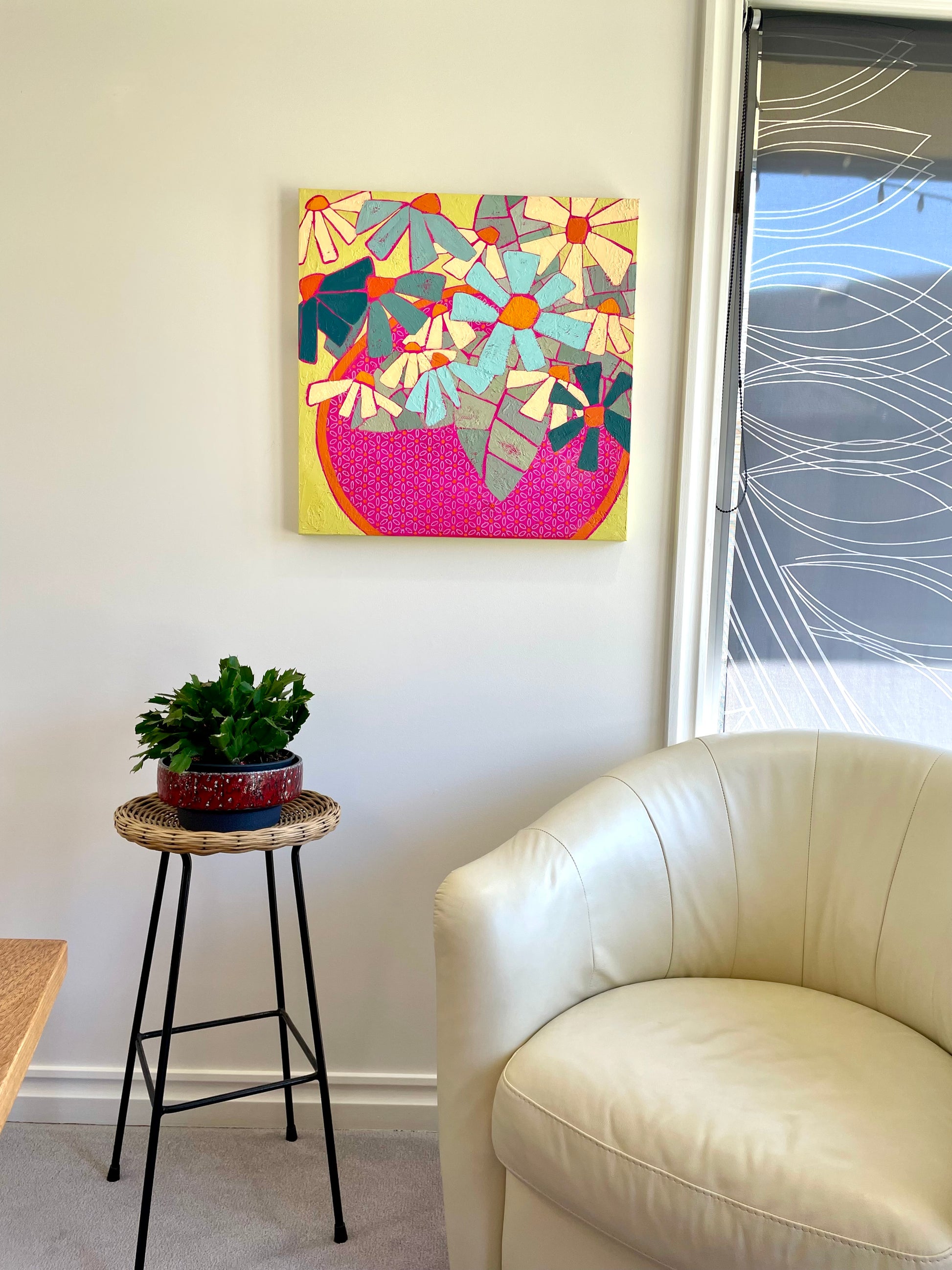 Abstract floral painting with bold daisies in a hot pink patterned bowl styled in a modern home interior, colourful statement art by Yvonne Nangle