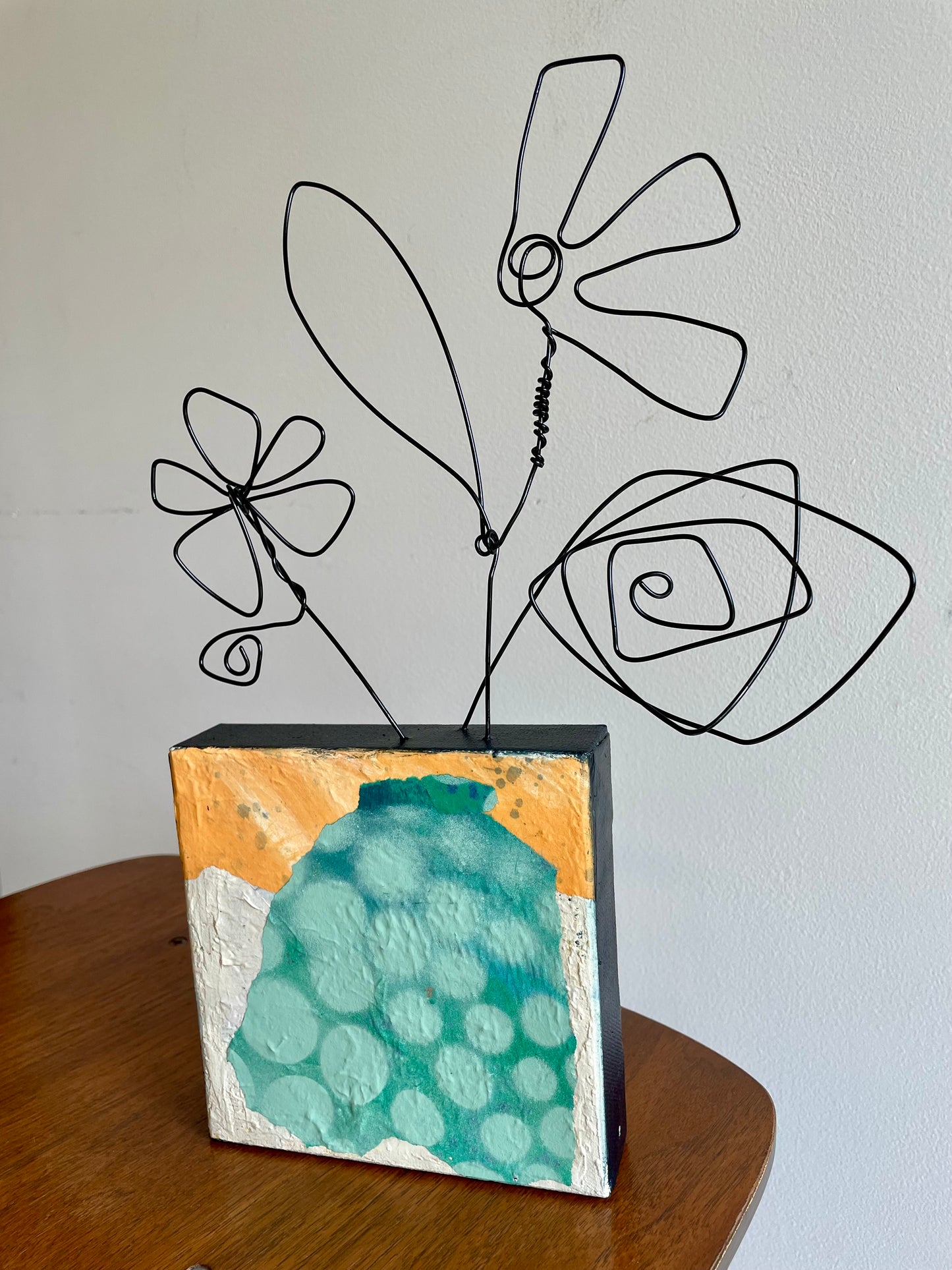 “The Bloom Above”  $150- 6"x 6" canvas with wire doodle flowers emerging from the top