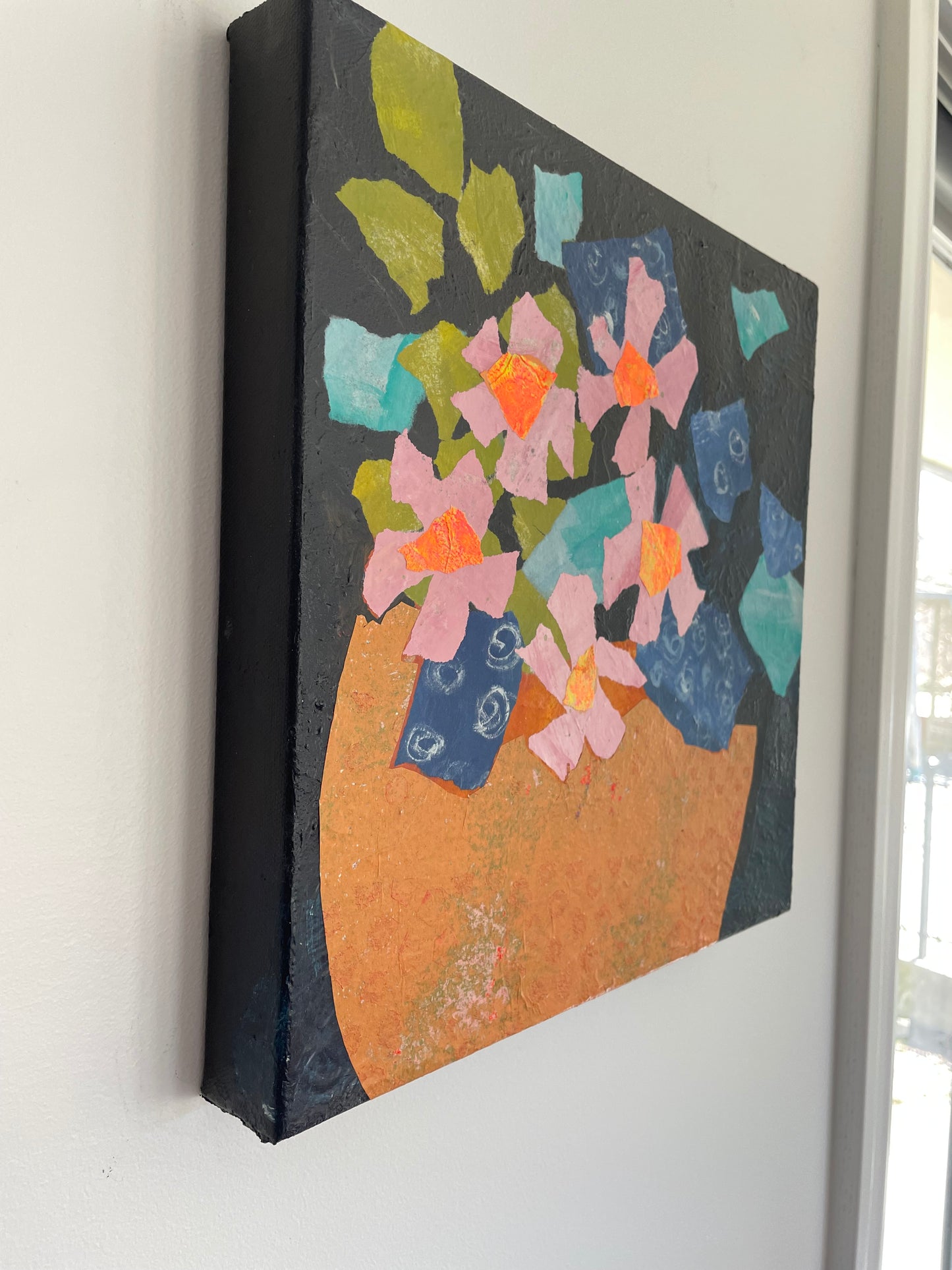 Left side view of original abstract floral painting showing painted paper collage texture and layered acrylic details on canvas edge