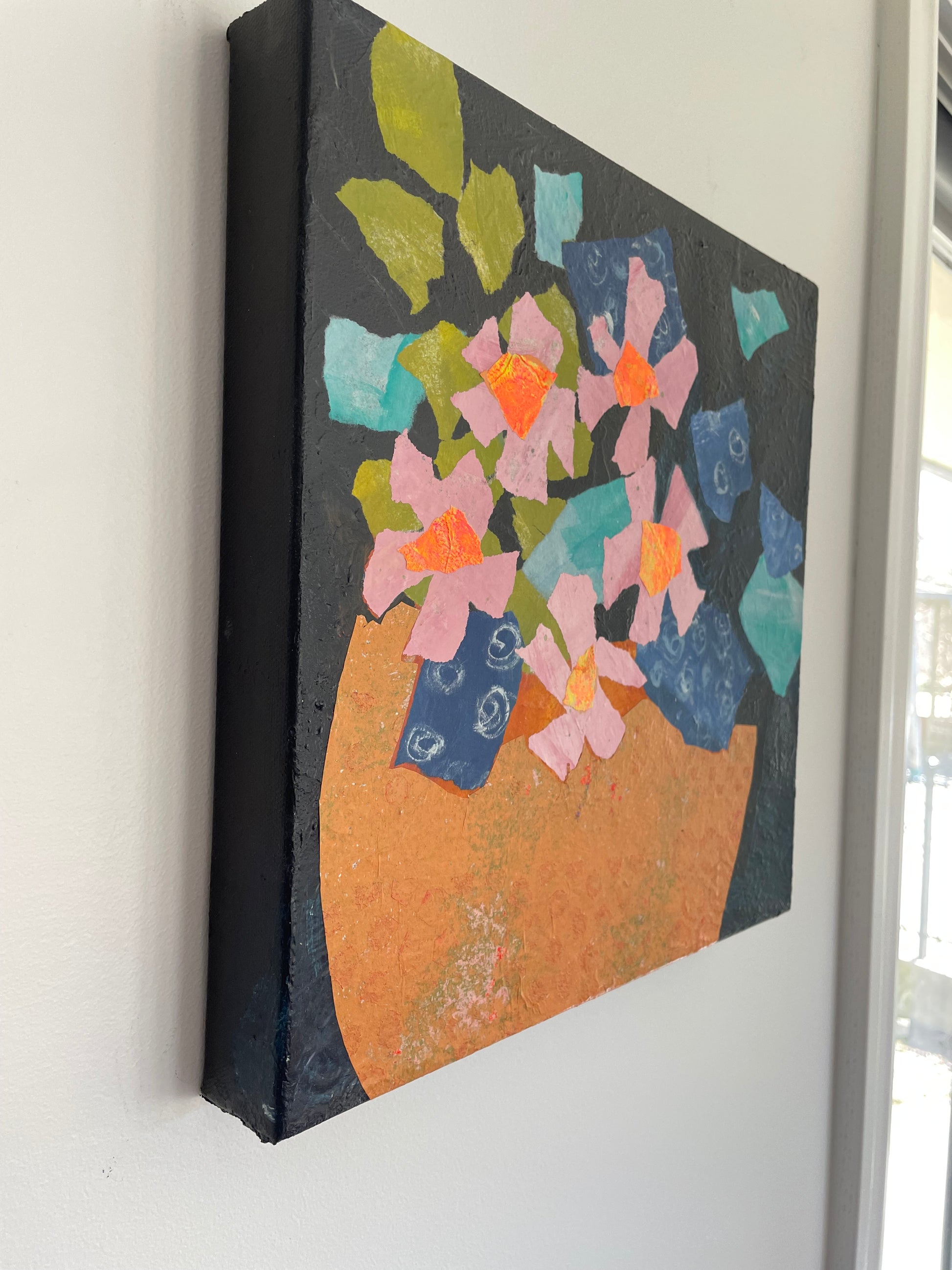 Left side view of original abstract floral painting showing painted paper collage texture and layered acrylic details on canvas edge
