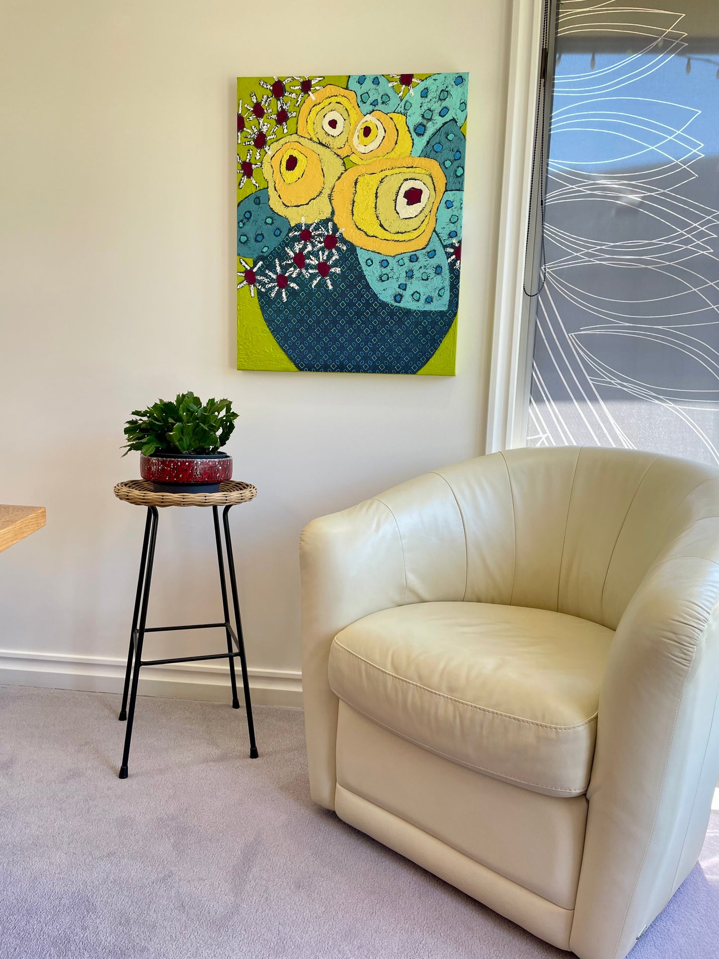 Lemon Bloom Uprising by Yvonne Nangle, colourful abstract floral painting shown in a modern interior, adding a bright focal point to the room